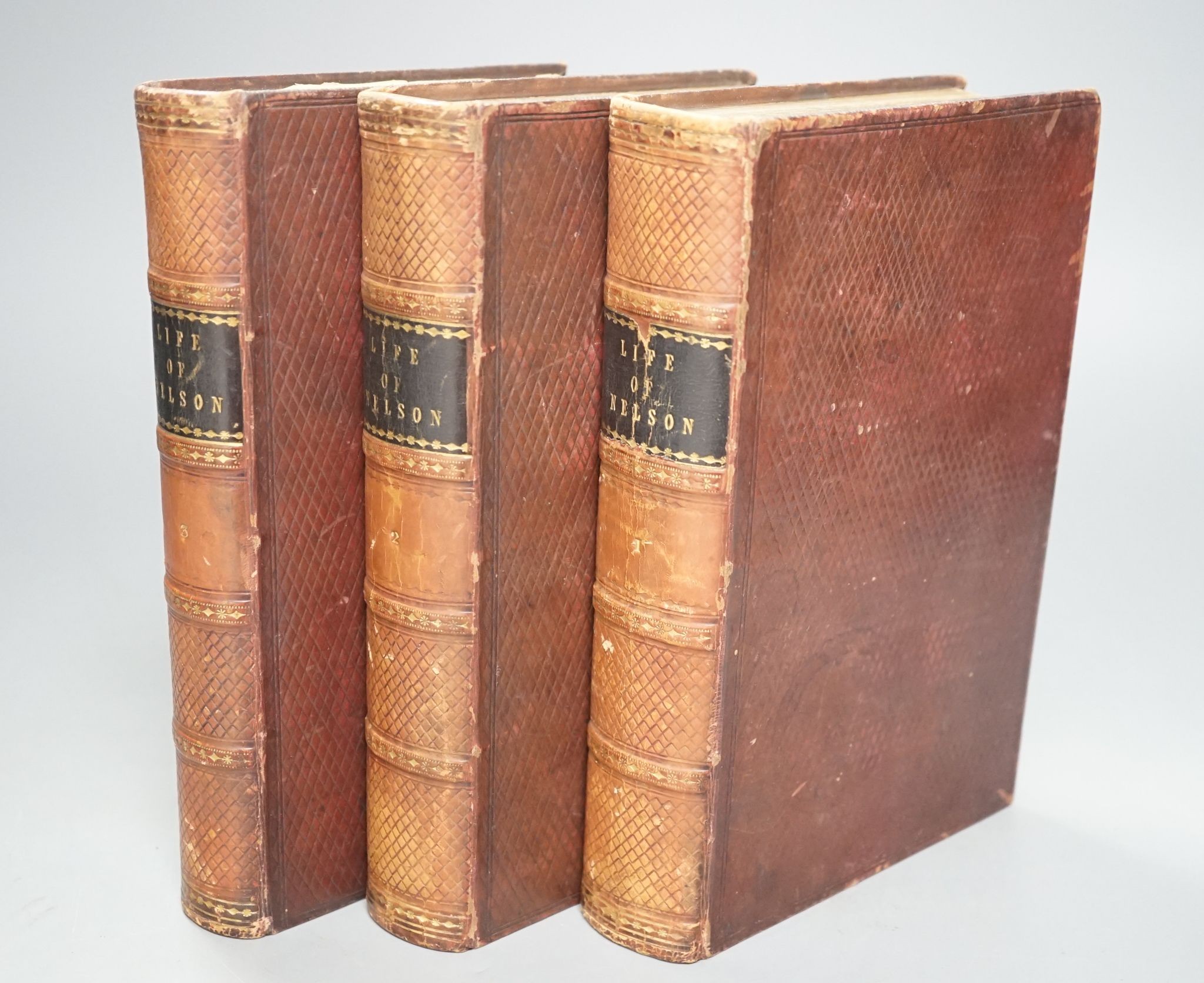 Clarke, Rev. James Stainer and M'Arthur, John - The Life and Services of Horatio Viscount Nelson ... (new edition), 3 vols, engraved pictorial and printed titles, 35 plates (but lacks Boulogne plan); contemp. diced calf,